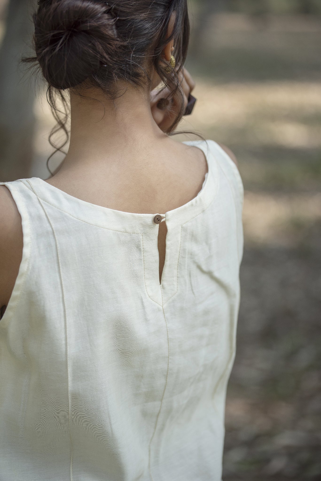 Off White Sleeveless Chanderi Silk Top with Centre Pin Tucks