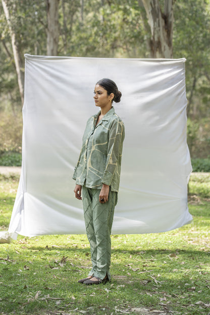 Luxury shirt and trouser set with Kantha embroidery
Designer Chanderi Silk outfit with diamond pin tuck detailing
Elegant olive green occasion wear by Riiti
Handcrafted Chanderi Silk co-ord set with side pocket trousers