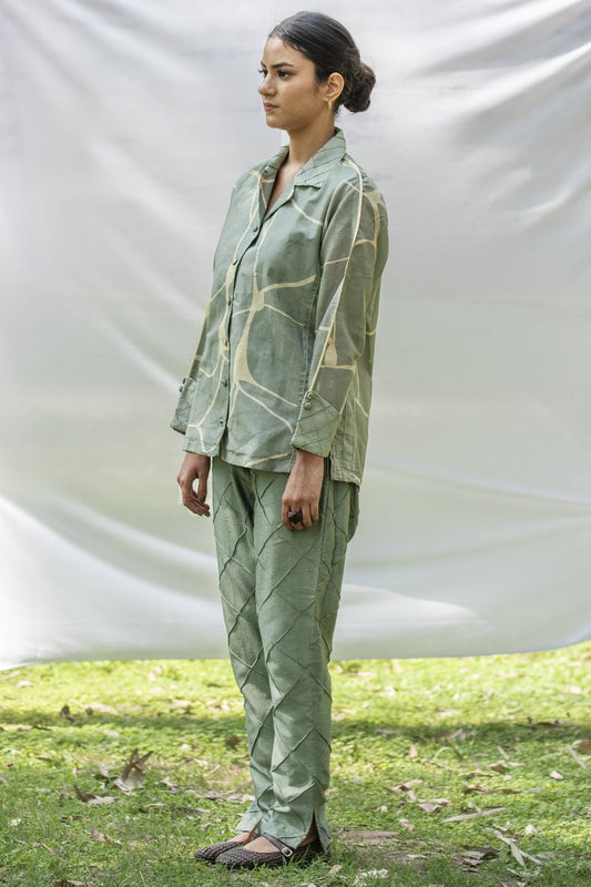 Luxury shirt and trouser set with Kantha embroidery
Designer Chanderi Silk outfit with diamond pin tuck detailing
Elegant olive green occasion wear by Riiti
Handcrafted Chanderi Silk co-ord set with side pocket trousers